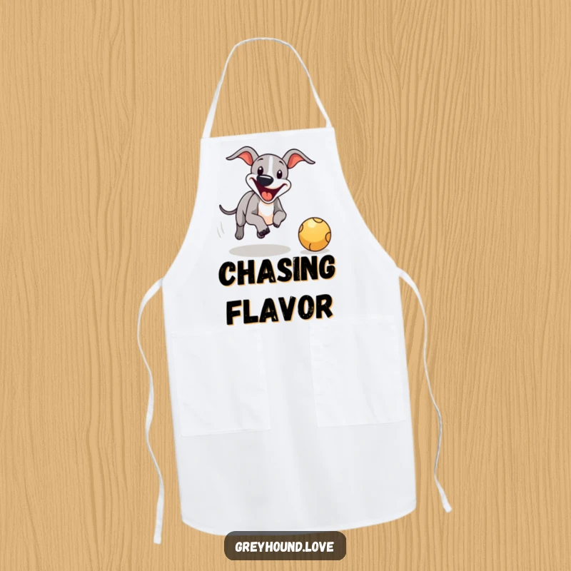 Funny greyhound ball chase apron, adorned with a happy dog chasing a bouncing ball for kitchen fun.