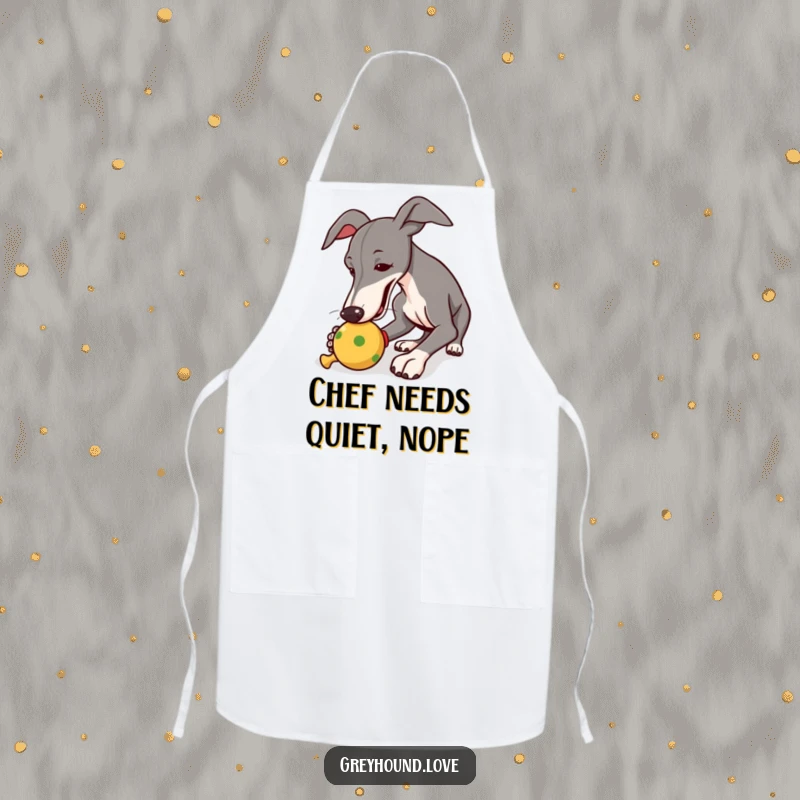 Funny apron showing a greyhound playfully nudging a squeaky toy, perfect for cooking with a sense of humor.