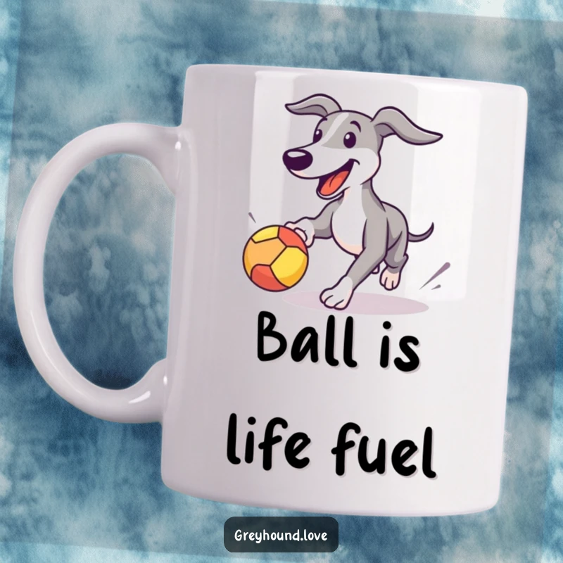 Funny Greyhound dog mug showing a happy canine playfully chasing a bouncing ball, radiating pure fun and excitement.