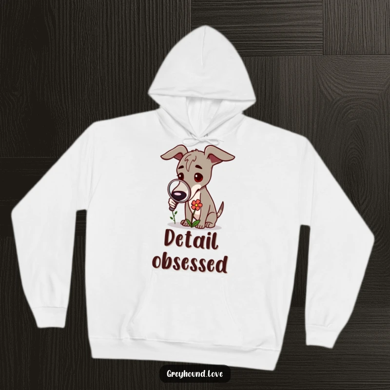 Funny Greyhound Hoodie: A curious greyhound is depicted using a magnifying glass to examine a flower.
