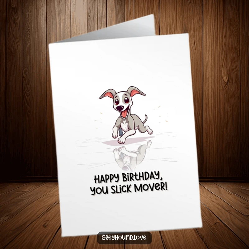 Funny Free Printable Birthday Card: Slender greyhound playfully sliding on a polished floor, tongue out.