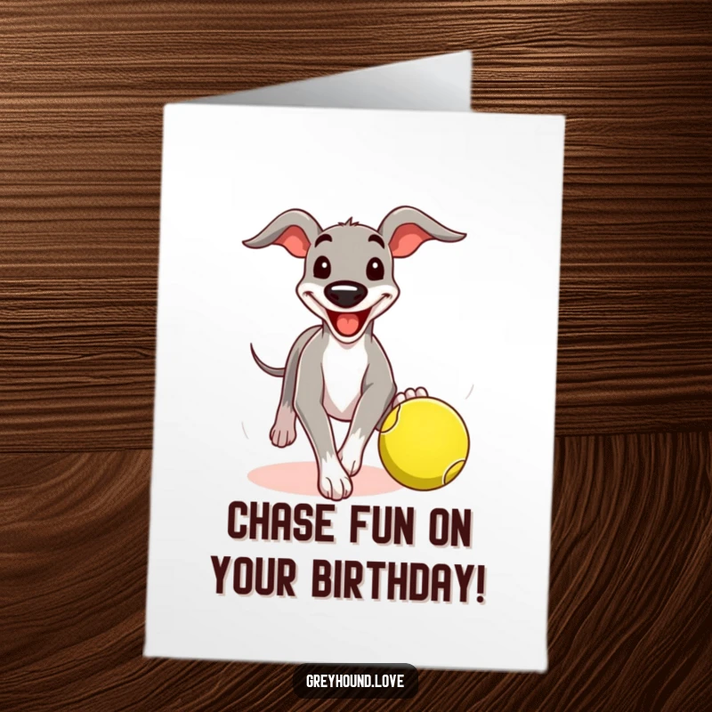 Funny Free Printable Birthday Card: Greyhound character grinning comically while chasing a tennis ball, wishing a happy birthday.