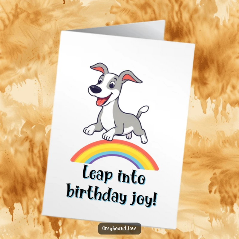 Joyful free printable birthday card of an excited greyhound leaping over a vibrant rainbow with a big grin.