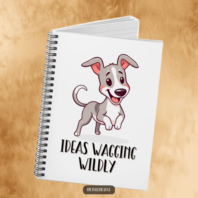 Funny greyhound wiggling with a furiously wagging tail on the cover of a notebook for jotting ideas.