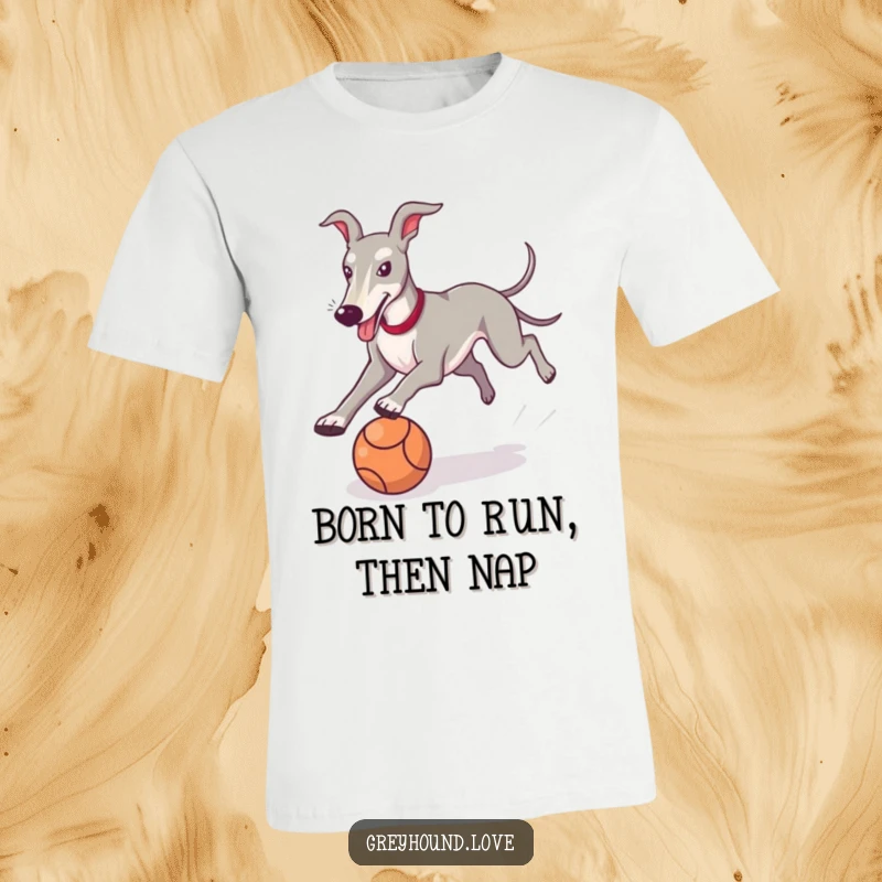 Funny Greyhound T-Shirt showing a happy dog in full chase after a rolling ball, radiating pure, unadulterated fun.