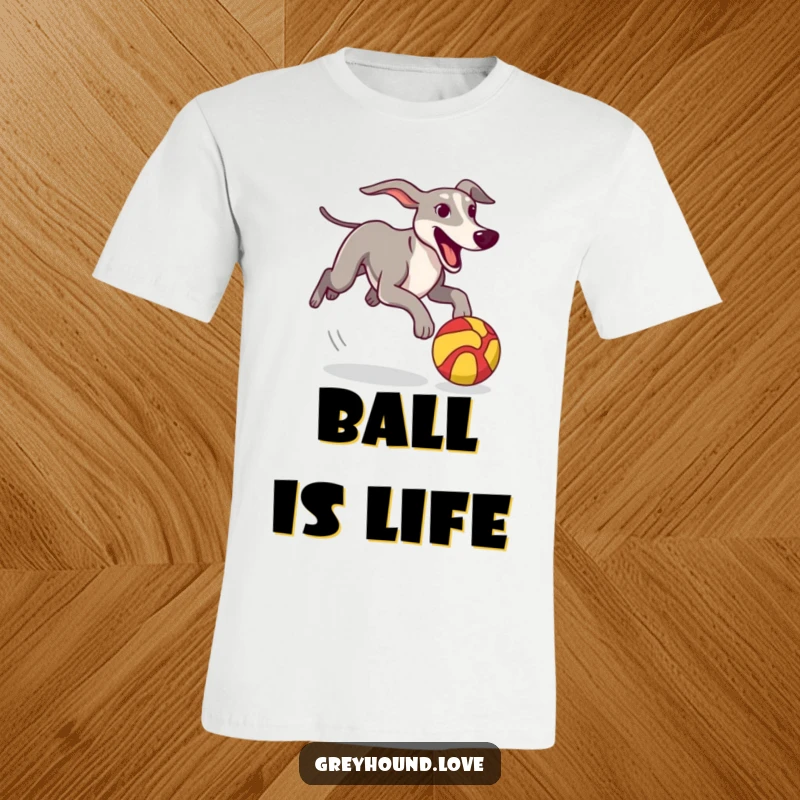 Funny T-Shirt depicting a greyhound in full pursuit of a bright, stylized ball, showcasing athletic fun.