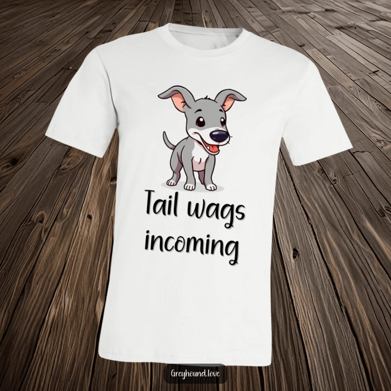 Funny T-Shirt showcasing a greyhound with prominent floppy ears, its tail a blur of motion from furious, happy wagging.