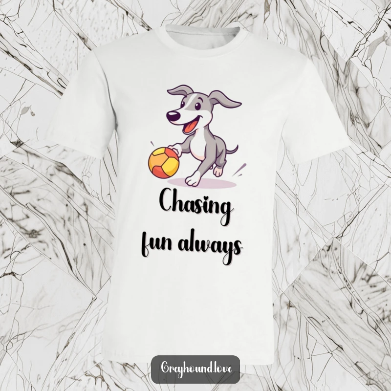 Funny Greyhound t-shirt featuring a happy dog energetically chasing a bouncing ball, capturing the joy of playtime.