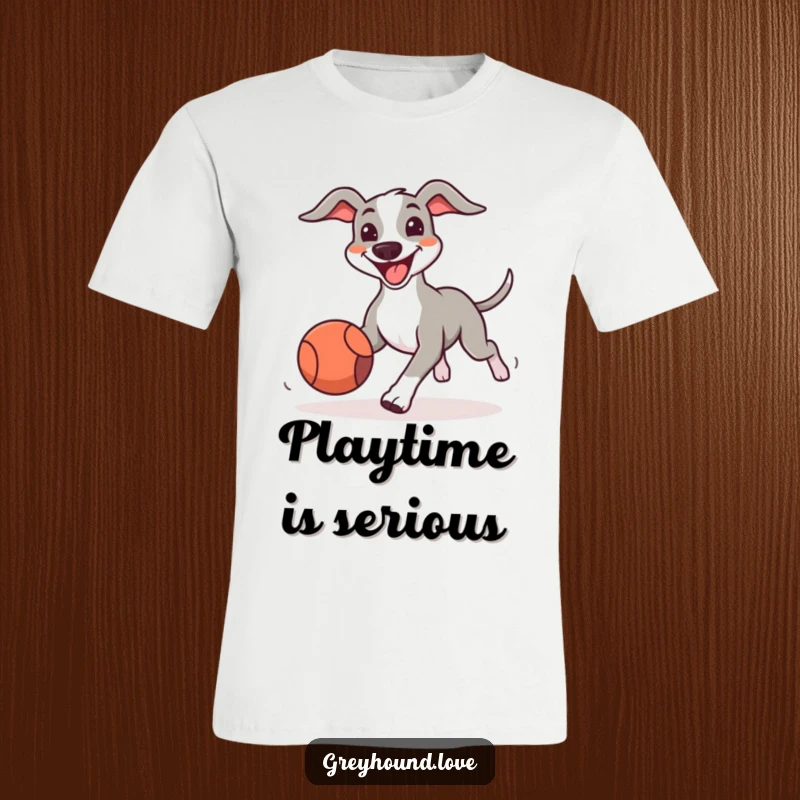 Funny Greyhound T-Shirt showing a big-smiling dog enthusiastically chasing a bouncing ball, radiating joy and playful spirit.