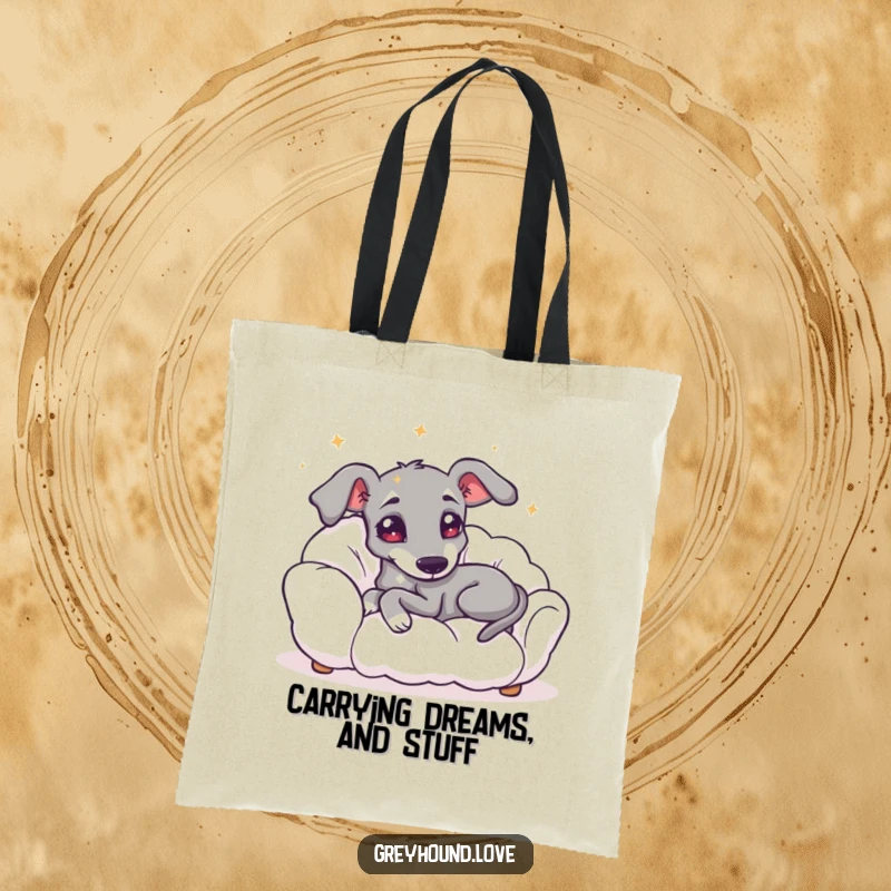 Funny tote bag displaying a greyhound with starry eyes, happily lounging on a fluffy cloud, perfect for carrying your essentials.