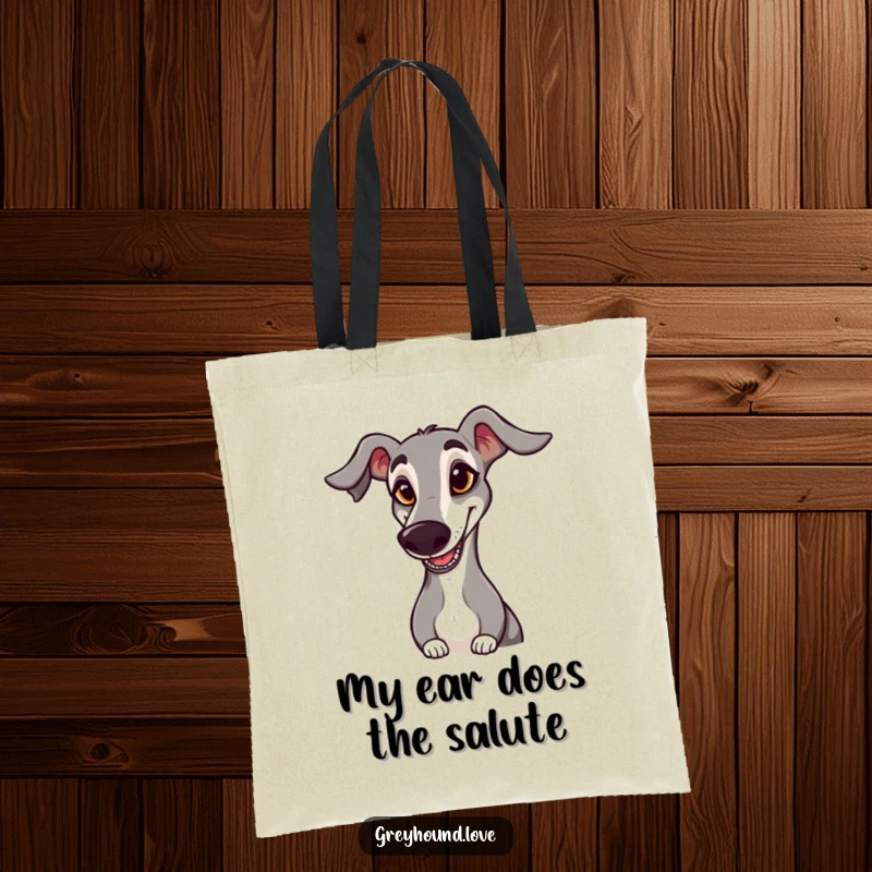 Funny TOTE BAG: A greyhound with a goofy expression and floppy ear hilariously salutes, perfect for carrying goodies.